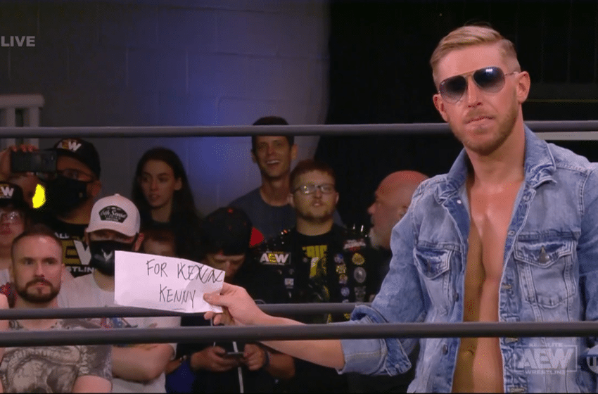 Orange Cassidy giving Kenny Omega a misspelled note on AEW Friday Night Dynamite May 28 2021