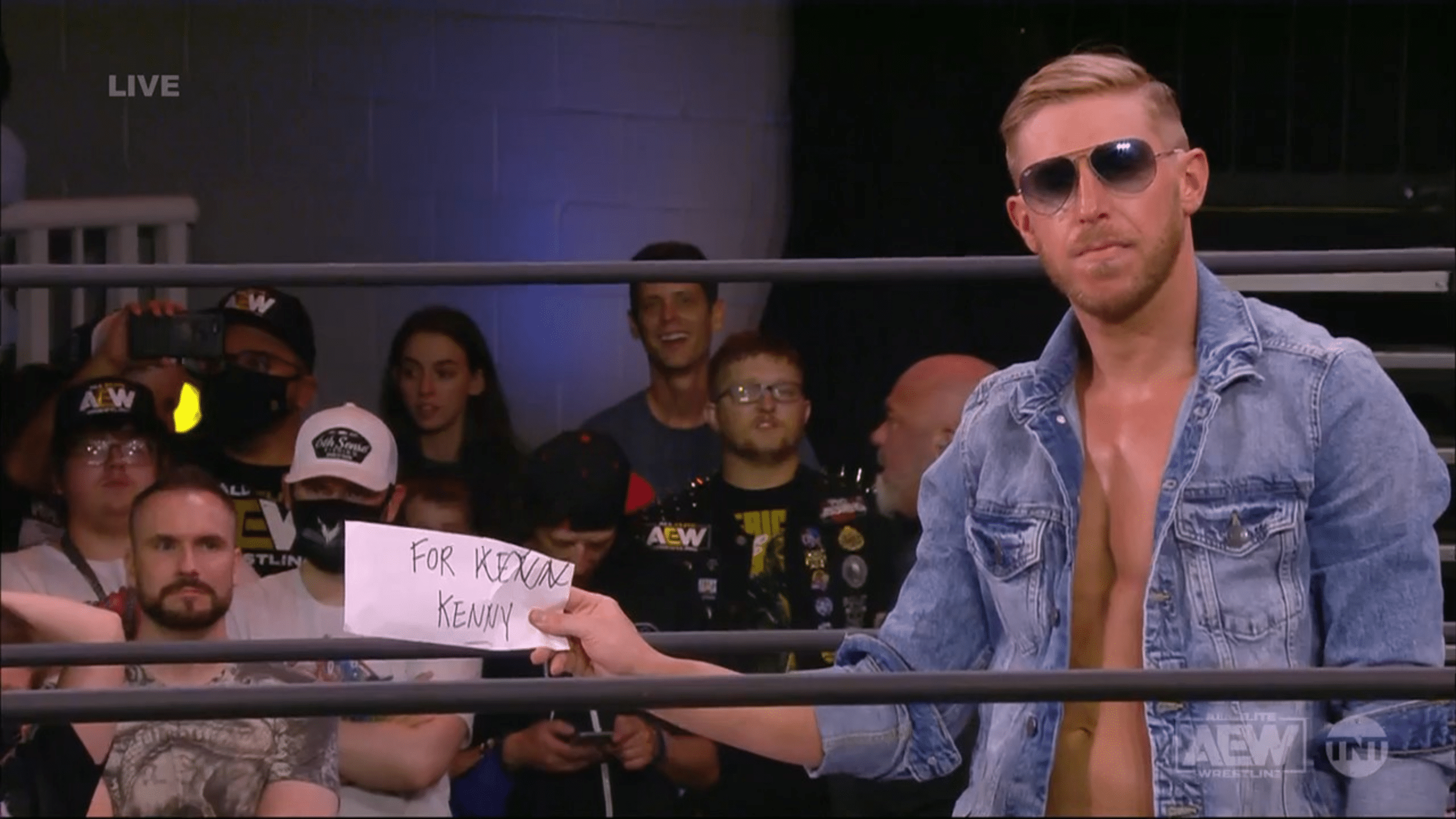 Orange Cassidy giving Kenny Omega a misspelled note on AEW Friday Night Dynamite May 28 2021