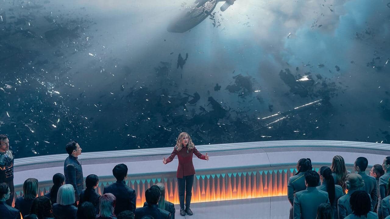 Nahla stands in front of the students with the Miyazaki in the background